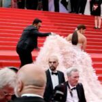 Pooja Hegde Instagram - The iconic red carpet stairs at the Cannes Film Festival. ❤️ What a rush this was 🥰 #grateful #cannes2022 #topgun