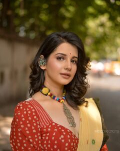 Angana Roy Instagram - Every city offers something unique for you to remember. As for my city, these yellow taxis are a takeaway.
There's just something about these yellow cabs that take me back to childhood, to a place full of endless hope.

@anushree_malhotra_designs thank you for making me look like this in your design!
Photography :@rieo_creations 
Makeup : @samitavod 
Hair : @bithi.roy.7712 

Organized by @inkcollab.pr 

✨

#design #sareelovers #loveforkolkata #yellowtaxi #yellowcab #calcuttadiaries #streetsofkolkata #redandyellow #shorthairstyle #streetphoto #childhoodmemories #designersaree #designerblouses #memories #redandwhite #yellowsaree #lookbook #tuesdaymood #tuesdayafternoon #tuesdayfeels #instaartsy #greenery #lovefromA