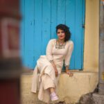 Angana Roy Instagram - Legend has it that if you look hard enough, you'll see the weekend approaching. Outfit- @anushree_malhotra_designs Photography- @rieo_creations Makeup- @samitavod Hair- @bithi.roy.7712 Shoes- @official.huedkick Organized by @inkcollab.pr ✨ #fridaypost #whitegram #blueandwhite #blueaesthetic #bluesky #designerclothes #streetsofkolkata #streetwear #fashionshoot #fashionphotography #newlook #ethnicjewellery #junkjewellery #curlyhairkillas #curlyhairstyle #newmonth #junedit #juneishere #lanes #indianaesthetics #background #portraitsofficial #picoftheday #photoseries #anganaroy #lovefromA