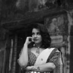 Angana Roy Instagram - Once Upon A Dream . . . . . @anushree_malhotra_designs @rieo_creations @samitavod @bithi.roy.7712 #saree #bnw #friday #fridaypost #lookbook #indianlookbook #ethnicwear #lookoftheday #ootd #igdaily #sareefashion #photoshoot #unedited #loveforfashion #loveforbnw #artsy #streetphotography #streetsofindia #vintage #oldwalls #oldbuildings #kolkatagram #mood #anganaroy #lovefromA