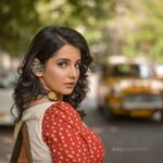 Angana Roy Instagram - Every city offers something unique for you to remember. As for my city, these yellow taxis are a takeaway. There's just something about these yellow cabs that take me back to childhood, to a place full of endless hope. @anushree_malhotra_designs thank you for making me look like this in your design! Photography :@rieo_creations Makeup : @samitavod Hair : @bithi.roy.7712 Organized by @inkcollab.pr ✨ #design #sareelovers #loveforkolkata #yellowtaxi #yellowcab #calcuttadiaries #streetsofkolkata #redandyellow #shorthairstyle #streetphoto #childhoodmemories #designersaree #designerblouses #memories #redandwhite #yellowsaree #lookbook #tuesdaymood #tuesdayafternoon #tuesdayfeels #instaartsy #greenery #lovefromA Kolkata