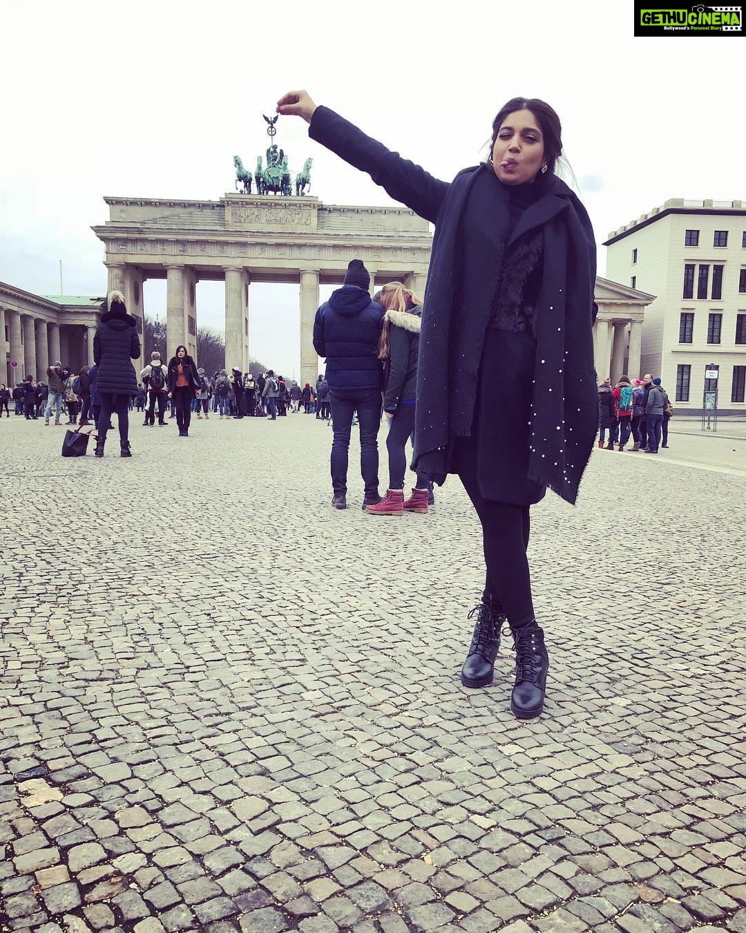 Bhumi Pednekar Instagram - So this is going to be my thing every time I visit a touristy monument- click a picture in the most cliche but cute,am holding the monument kind of pose🙈So here I am with my hand and tongue stretched out holding the #brandenburggate The Brandenburg Gate was made in the 18th century and today stands as a symbol of unity between Germany and other European countries. #Berlin #Berlinale2018 #vacation #work #tuesday #love #winter #brandenburggate #clichebutcute #poser #wednesday #morning