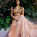 Deepti Sati Instagram - Deepti Sati (@deeptisati) in our Peach Lace lehenga set. 🧡🫶🏼 Featured here is our hand dyed peach lehenga set with delicate Chantilly Lace details. The blouse is heavily hand embroidered with frilled lace cap sleeves. The elaborate skirt comes in peach tulle with chantilly lace trims and lined with rich satin. Paired off with matching tulle dupatta with gold buttas.✨ Photographer: @clintsoman Makeup&Hair: @vijetha_karthik . . . #wedding #weddingdress #weddingoutfit #deeptisati #vocalforlocal #handembroidery #onlineshopping #blouseembroidery #fashion #outfits #ootd #embroidery #fashiongram #weddingoutfit #embellishment #peachlehenga #lehenga #peach #lacelehenga #embellished #indiandesigners #bridal #lehengalove #bridalfashion #chantilly #lehenga #lehengas #indianwear #indianwedding #bridal #bridallehenga #chantillylace