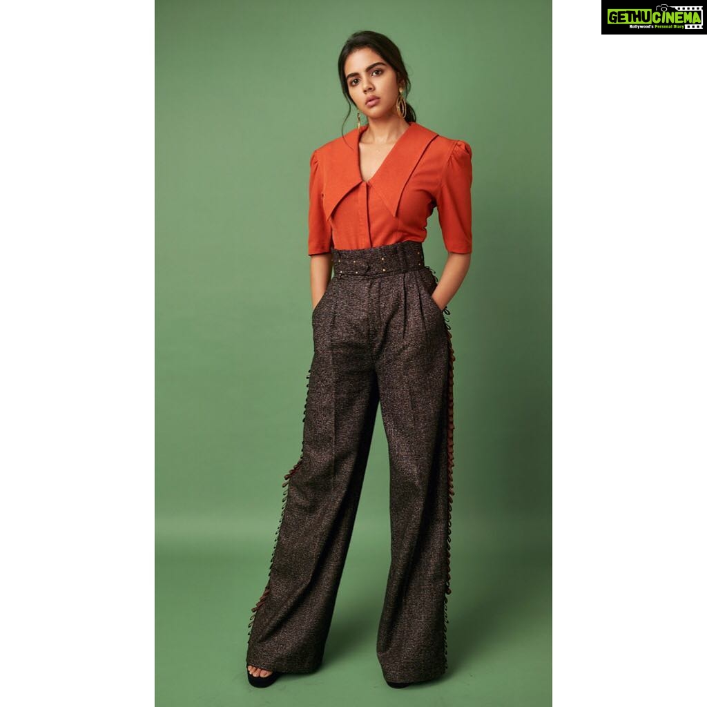 Kalyani Priyadarshan Instagram - Retro inspired by the original #chitralahari Doordarshan program - for media interviews Wearing a wide collar button blouse & flare pants set by @threepiececompany @rkbahuja Gold hoops by @aquamarine_jewellery Fashion Stylist @styledbyindrakshi Fashion Assistant @rishi_chowdary Photographer @akshay.rao.photography Makeup by @amitkagda Hair by @chinnahairstylist
