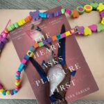 Lisa Ray Instagram - My year to date in a frame. Computer signals sometimes writing. Necklace crafted by little hands. And #TheHeartAsksPleasureFirst speaks for the first half of 2022 - chasing where the heart leads. Oh, and if you haven’t read this spectacular book by @karunaezara I envy you. The paperback is out and you can discover this utterly mesmerizing tale now.