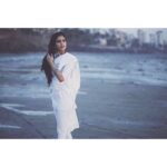 Malavika Mohanan Instagram - The smell of sea, soft murmurs of the evening breeze, sand caressing the feet and memories of times gone by.. 📸 @abhitakesphotos
