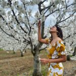 Malavika Mohanan Instagram – Saw a beautiful farm of almond trees in full bloom & ran around gushing over how pretty the flowers were 🥰 🌸 

@thejodilife I always feel so happy in yours designs! Homegrown brands for the win always 🤍