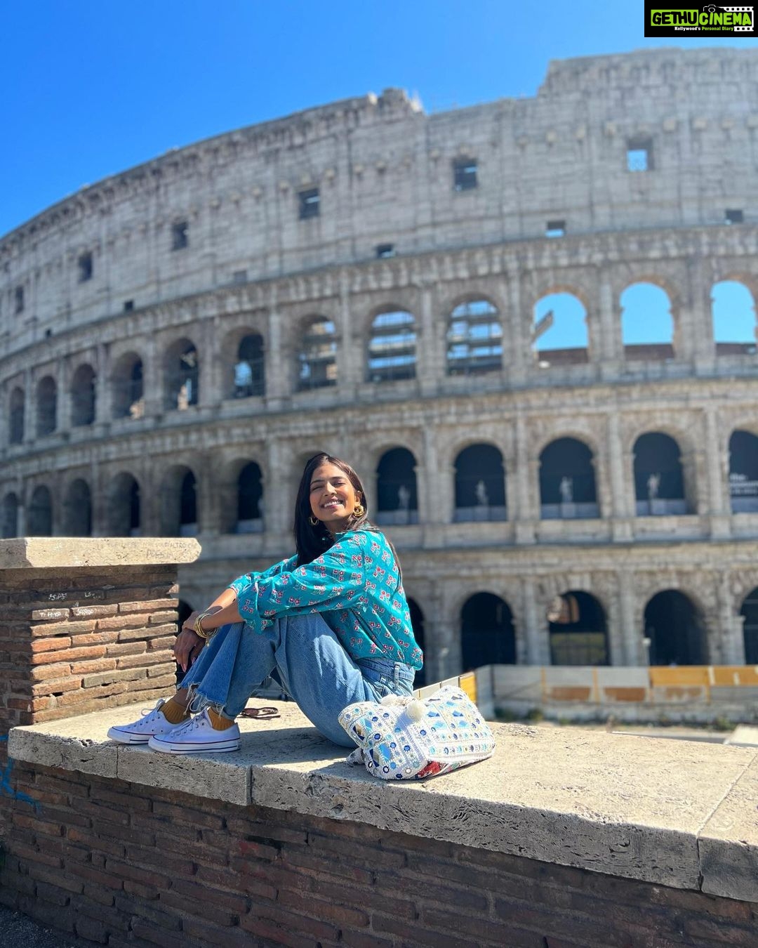 Malavika Mohanan Instagram - A magnificent colosseum & a happy Malu 🥰 Rome Colosseum, Italy