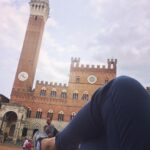Malavika Mohanan Instagram - One of the highlights of my solo Europe travel, this. Lying down in the main town square of Siena(a place I've craved to visit since having seen it in so many films and photographs), an extremely old little charming town in Tuscany. Watching the bell tower, the hustle of tourists all around me, enjoying some sun in the chilly breeze, taking a short nap literally in the middle of the streets. Such a lovely afternoon this was ♥️ Siena, Italy