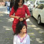 Malavika Mohanan Instagram – Aayushi doing my hair while I’m sitting on a random road in colaba causeway. Just a usual day.