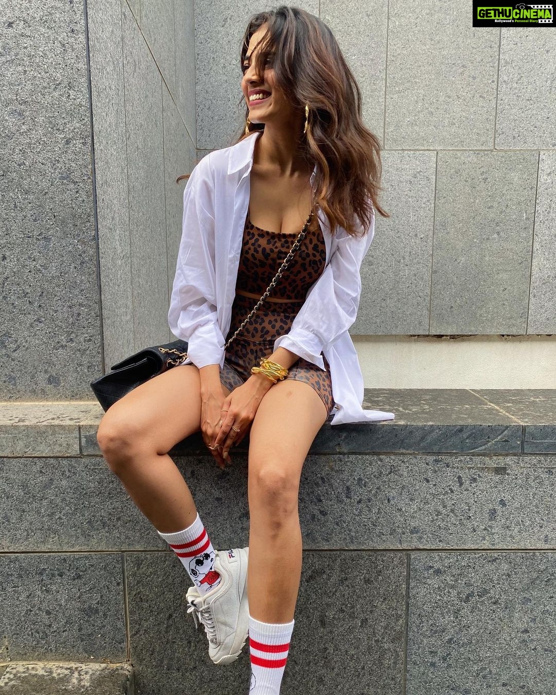 Malavika Mohanan Instagram - How can i not be smiley when there’s Snoopy on my feet? 🐶 🧦