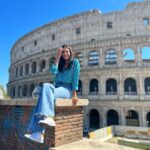 Malavika Mohanan Instagram - A magnificent colosseum & a happy Malu 🥰 Rome Colosseum, Italy