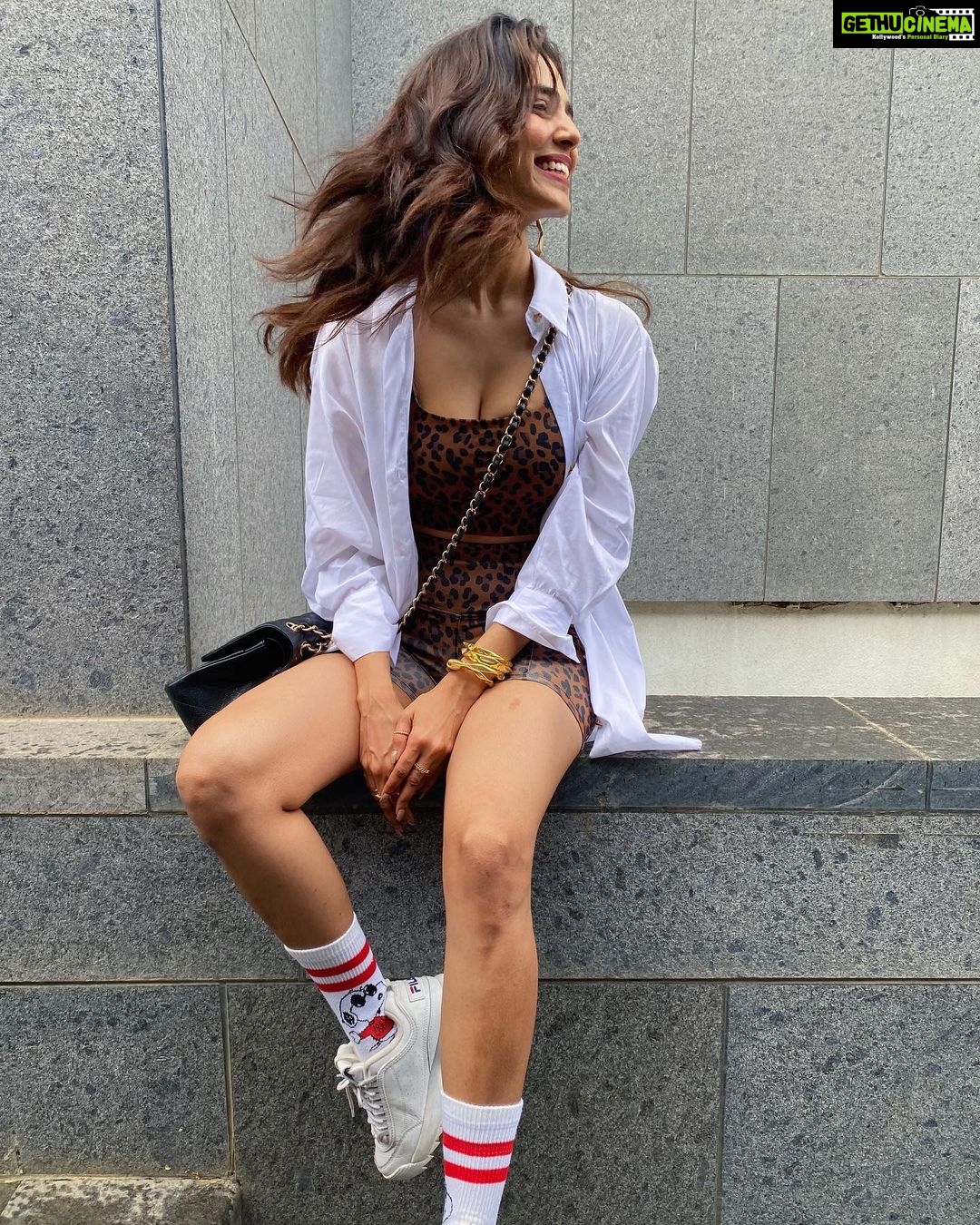 Malavika Mohanan Instagram - How can i not be smiley when there’s Snoopy on my feet? 🐶 🧦