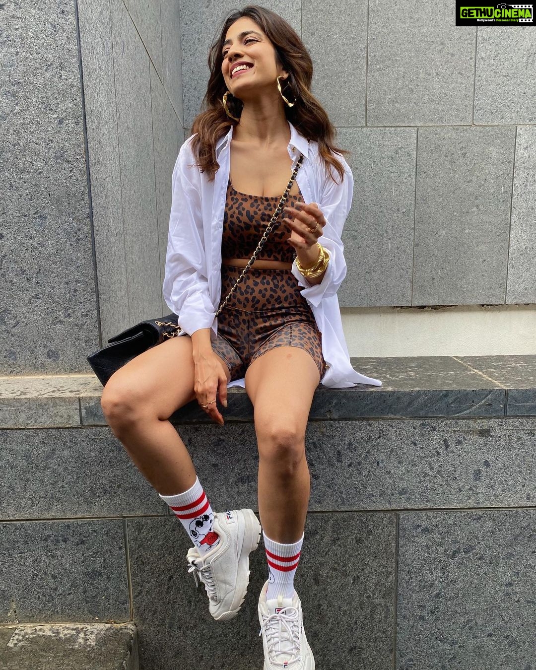 Malavika Mohanan Instagram - How can i not be smiley when there’s Snoopy on my feet? 🐶 🧦