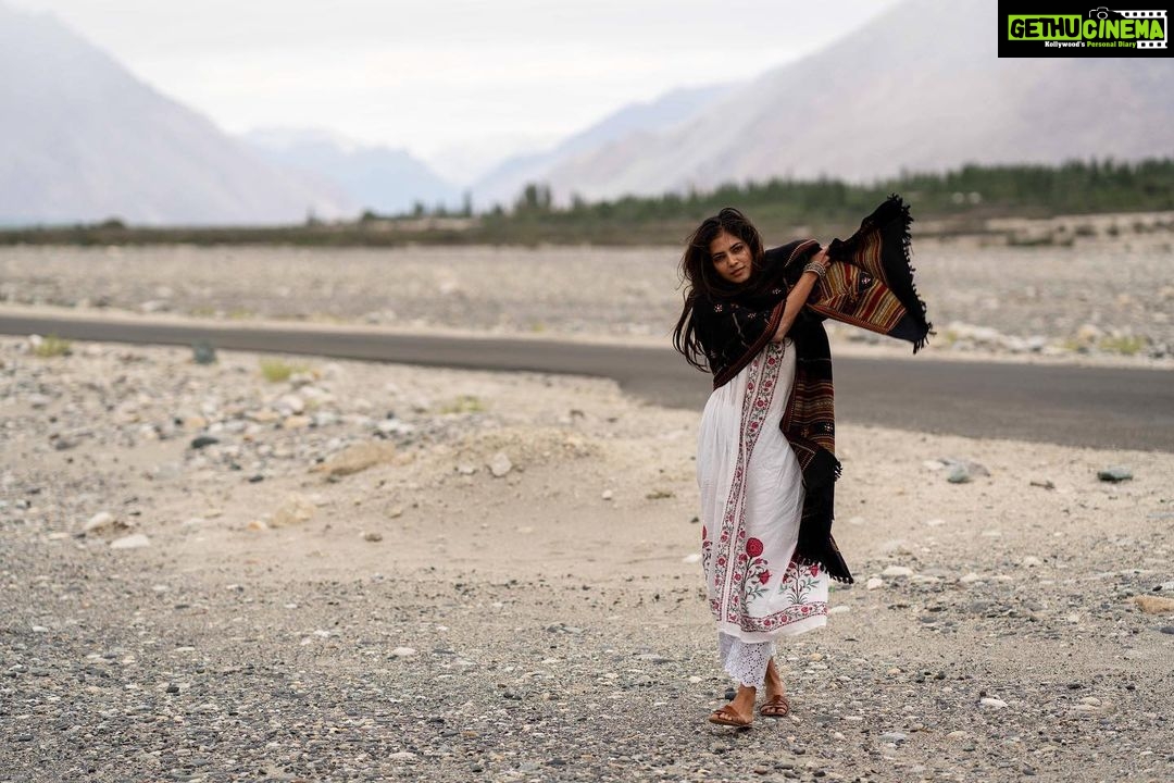 Malavika Mohanan Instagram - Getting lost in the most isolated and remote terrains is my favourite kind of travelling. Seeing the most unexpected sights which won’t be found in any Lonely Planet, stopping in the middle of nowhere and taking in the beauty and silence of the place which is so hard to find in a city like Mumbai, is so much more thrilling than following a tourist manual. This is me, last year, somewhere outside of Nubra Valley in Ladakh, soaking in some of the most beautiful sights I’ve ever seen ⛰♥️