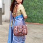 Nandita Swetha Instagram - Functionality meets style with Zouk bags. PETA approved cruelty-free brand that crafts ethically handcrafted premium bags and wallets for women. Carrying this bag makes you feel good and proudly Indian! Now don't ask why, try it yourself! Use my coupon code To get 15% off on Zouk bags IGNANDITAS15 @zoukonline . Saree from @shri_clothings__ #saree #bag #crueltyfree #collaboration