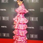 Pallavi Sharda Instagram – I’ve had the pleasure of dolling up, sitting next to, holding space and laughing along with some pretty incredible humans as we celebrated the release of #TheTwelve these past few weeks. 

As a woman of colour who was once (many times) told that there is no place for her on Australian screens, it gives me so much joy to have shared the company of so many that I admire, and to have felt their camaraderie, empathy and love. 

Sometimes, though, when asked to talk about my experiences as a ‘diverse’ actor 🤦🏽‍♀️ on Aussie screens, I bite my tongue, mince my words, or joke around the big bush that is the history of discrimination in our media industry. Sometimes the photograph belies the pain, the eloquence hides the rawness of unbelonging that so many have felt that still lives when I walk onto set everyday and find that sticker on the floor which tells me where to stand. 

As my courtroom colleagues and I gear up for audiences to see our hard work come to fruition – my heart and mind is set on the intention I hold dear when I go to work everyday: That this space is for everyone, and systems that don’t serve everyone don’t deserve to displace anyone. That the agency with which we are portraying our characters on screen ought to be endowed upon those who work tirelessly to fight for those characters’ existence & authenticity in the first place. That these conversations might actualise in the everyday.

It’s a privileged place from which to speak – talking about culture-making. But storytelling is the bedrock of community-building and its narrative has the power to steer people’s concept of who they are and how they belong for entire lifetimes.

#TheTwelve came to @foxtel tonight – I hope you get a chance to witness the talent that abounds each frame ✨