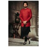 Santhosh Prathap Instagram – Deep red Sherwani with Asymmetrical Kurta. 
Can be customised to colour of your choice. 

Models: @santhoshprathapoffl @vekkey @kamurudin
Photo: @thevenkatbala
Creative & stylist: @jenson16
Makeup: @touchofandy
Menswear: #Singarajah
Production executive: @durai_making_moves_
Gaffer: @gopal_gaffer
.
.
.
.
.
.
.
.
#Singarajah #SingarajahMenswear #WearingSingarajah #TheMadrasGang #indianwedding #Groomwear #Menwithclass #Cocktailedit2022 #Santhosh #Sarpatta #SarpattaParambarai
 #Groomsofsingarajah #Bespoke #Madetomeasure #Sherwani #Kurtaformen #Tamilwedding #SingarajahShoes #Formalshoes #Veshti #Cocktailwear #Groomsinspiration