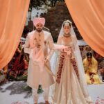 Simran Kaur Mundi Instagram - It was 2010 jab they met and i instantly knew that they were made for each other. From getting irritated everytime the word “shaadi” cropped up to now happily smiling on being called Mrs.Grover my pops has come a long way❤️ Wish you both a lifetime of love happiness and beautiful memories together. May god bless this beautiful jodi @poppyjabbal @karanvgrover with eternal bliss 🤗😘❤️