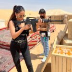 Sonal Chauhan Instagram - With my Dad’s favourite toy … Happy Father’s Day 🦾🔫 —————————————- PS- It’s a Working Still from my Movie Ghost’s Dubai schedule 🙏🏻 . . . . . . . . . . . . . . . . . . . . . . #ॐ #sonalchauhan #nagarjunaakkineni #ghost #dubai #shoot #actorslife #black #guns #action #desert #work