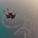 Ahana Kumar Instagram - So on this day , the Sunrise was at 5:33 AM , and I jumped off that plane at around 5:45 AM :) Feeling like a bird , flying in the sky watching a beautiful sun-rise , amidst clouds and above a city filled with sky-scrapers … my heart was filled with happiness , adrenaline and gratitude. Ah , what a moment ✨ Ofcourse I made a Vlog. It’s on the Channel. Watch me jump out a plane in slow-motion. Link in Bio and Stories😋✈️💫🤍🫶🏻 Dubai