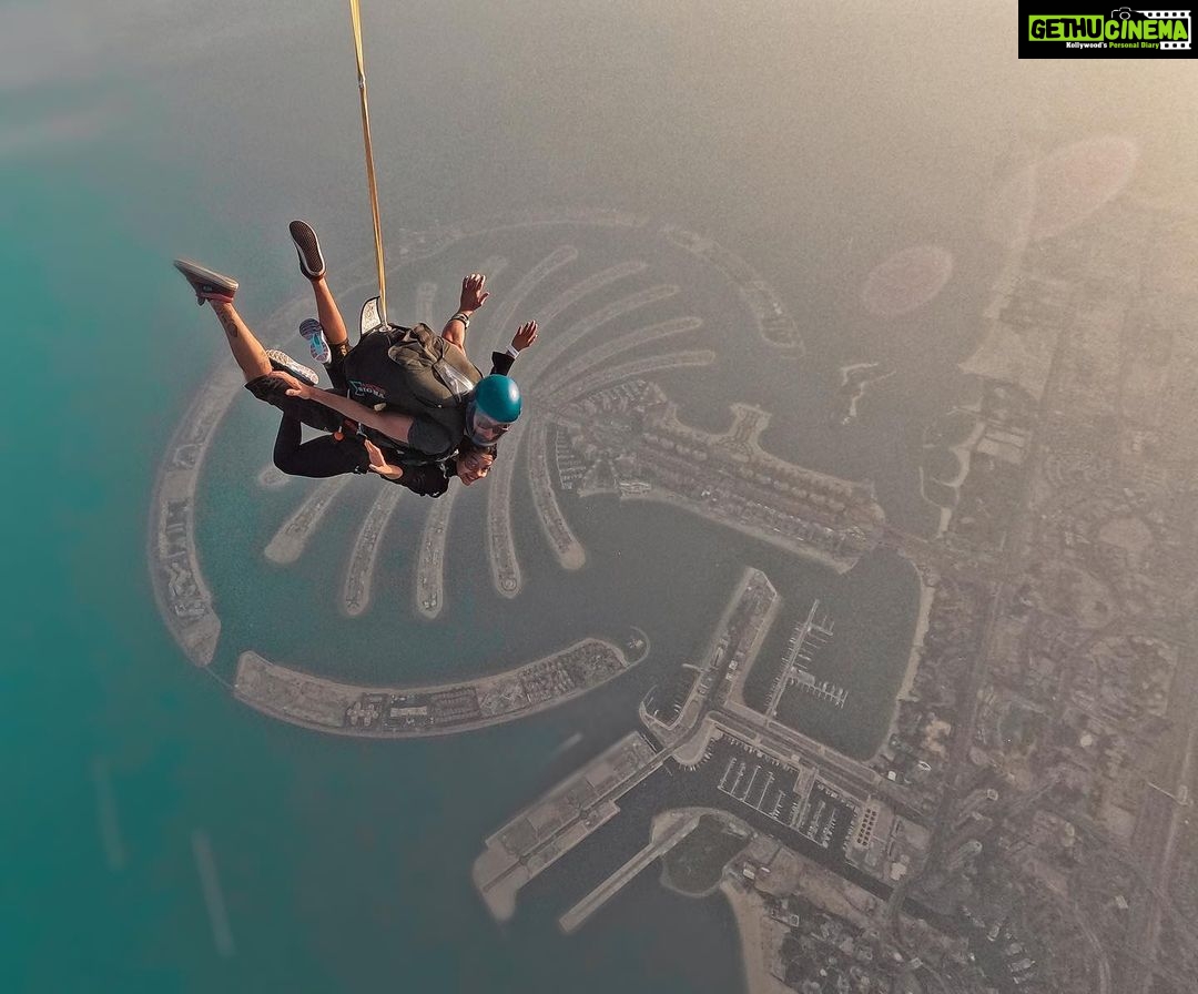 Ahana Kumar Instagram - So on this day , the Sunrise was at 5:33 AM , and I jumped off that plane at around 5:45 AM :) Feeling like a bird , flying in the sky watching a beautiful sun-rise , amidst clouds and above a city filled with sky-scrapers … my heart was filled with happiness , adrenaline and gratitude. Ah , what a moment ✨ Ofcourse I made a Vlog. It’s on the Channel. Watch me jump out a plane in slow-motion. Link in Bio and Stories😋✈️💫🤍🫶🏻 Dubai