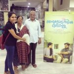 Aishwarya Lekshmi Instagram - Proudest moment ever in my life! In fr Njandu with parents! #nnoi Ariesplex SL Cinemas