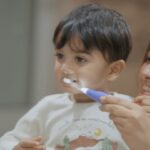 Anita Hassanandani Instagram - Aaravv like me loves snacking and I really encourage healthy eating habits for me. Along with that, I also encourage habits like daily brushing so that he develops it early on in his life. He has really started enjoying this process from the time I started using LuvLap JOY Baby Sonic Electric Toothbrush that has an LED light that keeps him entertained and cleans his teeth and massages his gums with 18,000 delicate vibrations per minute. And to go with that, I use the LuvLap Naturals 100% Natural Baby Toothpaste which is made with an aloe vera based formula that prevents the formation of bacteria and it contains SLS & Flouride, thus completely safe for babies. So go get these hygiene essentials for your baby only from LuvLap!