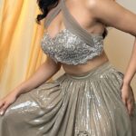 Deepti Sati Instagram - Deepti (@deeptisati ) vibing in our Sandy Cocktail Lehenga. 🪩 💃🏻 ✨ Featured here is our Cocktail Lehenga in Taupe which comes in a high slit ruffled skirt in water sequins and a embellished tube top with a criss-cross halter neck blouse. It can be paired with self colour tulle dupatta. Its the perfect ensemble for a glamorous cocktail party 🍸 or a sangeet 💃🏻! Either ways you’re going to be turning some heads 👸🏼 DM to order or customise this look 🛒🖤 #infinelinelabel #infineline #designer #lehengas #indianwear #sangeet #cocktail #deeptisati #wedding #ethnicwear #glam #slitskirt #sequins