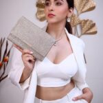 Eshanya Maheshwari Instagram - White on white 🤍✨ 📸- @portraitsbyvedant Blazer and pants - @atticsalt___ White crop top - @zara White heels- @mango earrings and necklace set - @accessorizeindiaofficial Golden clutch- @accessorizeindiaofficial #white #suit #fashion #style #fashionmodel #styleblogger #esshanyamaheshwari #eashanya #poser #instafashion #instastyle