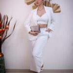 Eshanya Maheshwari Instagram - White on white 🤍✨ 📸- @portraitsbyvedant Blazer and pants - @atticsalt___ White crop top - @zara White heels- @mango earrings and necklace set - @accessorizeindiaofficial Golden clutch- @accessorizeindiaofficial #white #suit #fashion #style #fashionmodel #styleblogger #esshanyamaheshwari #eashanya #poser #instafashion #instastyle