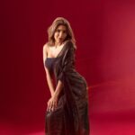 Nikki Tamboli Instagram - Behold the Begum-e-Hindustan💫 Shoot: @fablookmagazine Styled by @milliarora7777 Assisted by @mininarula02 Wearing: @labelnehasaxena Mua @smridhimehtamua Hair: @nadeem.artist 📸 @shutterstrings Publicist: @planetmediapr . . . . . . . . #nikkitamboli #nikkians #indianwear #saree #sareelovers #black #shine #glitter #smile #love #xoxo