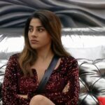 Nikki Tamboli Instagram - It's Saturday night, Thing's are going pretty right, #NikkiTamboli is always up to give back a fight, Are you all sticking to your seats tight? 😉 Catch her tonight at 9pm only on @colorstv as its #weekendkavaar 🤩 . Earrings : @fhaze.london @xxessories Styled by : @stylebytaashvi . . @endemolshineind @vootselect #TeamNikki #TamboliKiToli #NikkiIsTheBoss #BiggBoss2020 #BB14 #NikkiRulingBB14 #colorstv #BiggBoss14
