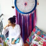 Rajisha Vijayan Instagram – Mornings I miss. :)
Who doesn’t have a favourite spot in their house! Meet mine, the balcony. A place where you can ponder into a book, sip some hot tea, meditate or simply just look at the world from a whole new angle. 💕
This huge dream catcher that becomes the centrepiece of my happy place was woven by some very talented women artists who come together to create @soul_works_mumbai 🙌🏼💕
Also this one lits up at night and well that’s for another time.
Cloud cushions that you can melt into, are from @decor_kraft ☁️🌈