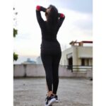 Raveena Daha Instagram - How flexible are you? 😉 Outfit from: @dhanshicollections ❤️ This track suit is sooo comfy to wear 🥺 Attitude shoe from: @vijay_felix_official @my_attiitude By "chris gayle" 🖤 #raveena #raveenadaha
