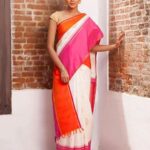 Sanchana Natarajan Instagram - #Repost @tulsisilks with @repostapp ・・・ White effervescence with pink and orange hues, perfect for the summer! Shot by @avabhay ✨. . . . . #Kanjeevaram #Kanjivaram #silksaree #tulsisilks #instafashion #saree #whitesaree #kanchipuramsilk