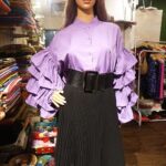 Vanitha Vijayakumar Instagram - Casual stand collar tiered ruffles bell sleeve shirt💜🤍🖤Dm for price & details📩 #vanithavijaykumarstyling #outfitoftheday #outfit #outfits #women #womensfashion #girl #girls #style #styling #stylist #fashion #ootd #picoftheday #pictureoftheday #dress #accessories #makeover #onlineshopping #onlineshop #boutique #boutiqueshopping #boutiquefashion Khader Nawaz Khan Road