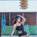 Avneet Kaur Instagram - Sitting real pretty.🖤 Stylist: @styling.your.soul Swimwear: @hottcurves.beachwear
