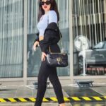 Avneet Kaur Instagram - I wore this outfit yesterday but I’m going different places today… So it’s okay!🖤 #ootd Top- @baesic_world Pants- @zara Jacket- @hm Shoes- @nike Bag- @gucci Shades- @versace 📸- @krupalakhanii.16 Mumbai, Maharashtra