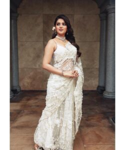 Nidhhi Agerwal Instagram - She was temptation wrapped in simple elegance 🤍🕊🦢🐚🍦🏹❤️‍🔥

Styled by: @nikhitaniranjan
Shot by: @livingin24fps 
Photography team: @anupamasindhia
Outfit: @roujeofficial 
Jewellery: @konikajewellery
Hair: @priyahairandmakeup_