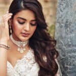 Nidhhi Agerwal Instagram - She was temptation wrapped in simple elegance 🤍🕊🦢🐚🍦🏹❤️‍🔥 Styled by: @nikhitaniranjan Shot by: @livingin24fps Photography team: @anupamasindhia Outfit: @roujeofficial Jewellery: @konikajewellery Hair: @priyahairandmakeup_