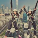 Parvatii Nair Instagram - Living on the edge !! The edge walk was super fun n super scary at the same time . At a height of 220 meters , this really made me feel like m on top of the world !@visitdubai @skyviewobservatory #dubaidestinations #dubai #dubailife #visitdubai Colors by @infinity_skylight Sky Views Observatory