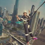 Parvatii Nair Instagram - Living on the edge !! The edge walk was super fun n super scary at the same time . At a height of 220 meters , this really made me feel like m on top of the world !@visitdubai @skyviewobservatory #dubaidestinations #dubai #dubailife #visitdubai Colors by @infinity_skylight Sky Views Observatory