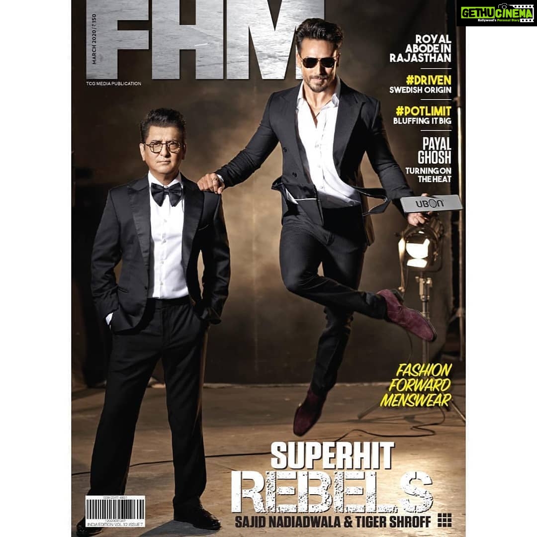 Tiger Shroff Instagram - #Repost @fhmindia • • • • • Our cover stars for March issue, Bollywood’s most successful actor-producer duo, Tiger Shroff (@tigerjackieshroff ) and Sajid Nadiadwala are back to set your screens on fire. Photography: Avinash Gowariker (@avigowariker ) Stylist: Nikita Jaisinghani (@nikitajaisinghani ) For Tiger Hair: Amit Yashwant (@amityashwant_hair ) Makeup: Rahul Kothavale (@rahulkothavale ) For Sajid Hair: Bhushan Shinde (@imbhushanshinde ) Makeup: Ajay Naik (@naik8844 ) Location Courtesy: Mehboob Studios, Mumbai _ Wardrobe Courtesy 👗 On Tiger- Suit: Anuj Madaan Shirt: Zara Shoes: Paul Smith Speaker: UBON SP-55 Melody Bass (@ubon_official ) On Sajid- Blazer: SS Homme Bowtie: Herringbone & Sui Glasses: Komono Shoes: Pelle Santino _ #march #march2020 #marchissue #marchcoverstars #TigerShroff #SajidNadiadwala #Baaghi3 #actionstar #filmmaker #BollywoodActor #magazine #magazinecover #magazinecoverstar #magazinephotoshoot #menslifestyle #mensmagazine #fhm #fhmmagazine #fhmcover #fhmindia