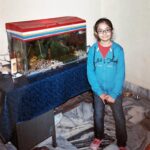 Anushka Sen Instagram - Recreated some of my pictures from Jamshedpur ( nana Nani’s house ) 🫶🥰 . P.S Mithu the parrot and the fishes are older to me 😂 We are growing up together 😬