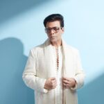 Karan Johar Instagram - The power of White light! In @farazmanan styled by @ekalakhani 📷 @rahuljhangiani