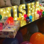 Mira Rajput Instagram - Life in Technicolour 🌈 This year M’s birthday was all about rainbow, bright colours, and less complicated decor! Last year I was super excited to be a DIY party planner. Two birthdays and a year later, all I can think of is arriving at the birthday like a guest! I reduced the decor fuzz and switched it with fun lights instead that were easier to handle and use in many ways (and later too). I picked up a fresh set of theme specific rainbow plates and napkins for cake from @partyalacarte17 and stuck to the bamboo ones for party grub. And I found a super convenient website @thememypartyofficial that delivers very well priced theme specific party supplies including straws, sandwich toppers, the backdrop, paper lanterns and colour coordinated balloons. We had popcorn from the popcorn containers leftover from last year and the rest of the snacks laid out for kids to dig in in mix-n-match crockery. My mom made her signature sandwich house: how many of you had them at your birthdays in the 90s? I always lay out the table before the party itself so there’s less madness later. I love this table cover from @thewishingchair and the crockery from this set (not used here) is equally lovely. The rainbow fringe, rainbow wrapping and a devilishly convenient balloon machine was from @amazondotin. Ofcourse the alphabet lights from @dohremico brought it all together (and I’ve ordered an extra Z & N so we can make a Zain out of the Misha 😋) along with the most fun prizes and party favours. Dog & the bone, Lemon spoon race and treasure hunt for all ages was too much fun. I think the adults enjoyed it a lot more than the kids. The cake was DIVINE. Vanilla cake with chocolate mousse filling instead of buttercream on a custom order @the_kitchenette_jalandhar I’d love to know how you all are celebrating kiddie birthdays cause I am ready to retire and I have another one in 4 days!