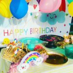Mira Rajput Instagram - Life in Technicolour 🌈 This year M’s birthday was all about rainbow, bright colours, and less complicated decor! Last year I was super excited to be a DIY party planner. Two birthdays and a year later, all I can think of is arriving at the birthday like a guest! I reduced the decor fuzz and switched it with fun lights instead that were easier to handle and use in many ways (and later too). I picked up a fresh set of theme specific rainbow plates and napkins for cake from @partyalacarte17 and stuck to the bamboo ones for party grub. And I found a super convenient website @thememypartyofficial that delivers very well priced theme specific party supplies including straws, sandwich toppers, the backdrop, paper lanterns and colour coordinated balloons. We had popcorn from the popcorn containers leftover from last year and the rest of the snacks laid out for kids to dig in in mix-n-match crockery. My mom made her signature sandwich house: how many of you had them at your birthdays in the 90s? I always lay out the table before the party itself so there’s less madness later. I love this table cover from @thewishingchair and the crockery from this set (not used here) is equally lovely. The rainbow fringe, rainbow wrapping and a devilishly convenient balloon machine was from @amazondotin. Ofcourse the alphabet lights from @dohremico brought it all together (and I’ve ordered an extra Z & N so we can make a Zain out of the Misha 😋) along with the most fun prizes and party favours. Dog & the bone, Lemon spoon race and treasure hunt for all ages was too much fun. I think the adults enjoyed it a lot more than the kids. The cake was DIVINE. Vanilla cake with chocolate mousse filling instead of buttercream on a custom order @the_kitchenette_jalandhar I’d love to know how you all are celebrating kiddie birthdays cause I am ready to retire and I have another one in 4 days!