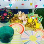 Mira Rajput Instagram - Life in Technicolour 🌈 This year M’s birthday was all about rainbow, bright colours, and less complicated decor! Last year I was super excited to be a DIY party planner. Two birthdays and a year later, all I can think of is arriving at the birthday like a guest! I reduced the decor fuzz and switched it with fun lights instead that were easier to handle and use in many ways (and later too). I picked up a fresh set of theme specific rainbow plates and napkins for cake from @partyalacarte17 and stuck to the bamboo ones for party grub. And I found a super convenient website @thememypartyofficial that delivers very well priced theme specific party supplies including straws, sandwich toppers, the backdrop, paper lanterns and colour coordinated balloons. We had popcorn from the popcorn containers leftover from last year and the rest of the snacks laid out for kids to dig in in mix-n-match crockery. My mom made her signature sandwich house: how many of you had them at your birthdays in the 90s? I always lay out the table before the party itself so there’s less madness later. I love this table cover from @thewishingchair and the crockery from this set (not used here) is equally lovely. The rainbow fringe, rainbow wrapping and a devilishly convenient balloon machine was from @amazondotin. Ofcourse the alphabet lights from @dohremico brought it all together (and I’ve ordered an extra Z & N so we can make a Zain out of the Misha 😋) along with the most fun prizes and party favours. Dog & the bone, Lemon spoon race and treasure hunt for all ages was too much fun. I think the adults enjoyed it a lot more than the kids. The cake was DIVINE. Vanilla cake with chocolate mousse filling instead of buttercream on a custom order @the_kitchenette_jalandhar I’d love to know how you all are celebrating kiddie birthdays cause I am ready to retire and I have another one in 4 days!