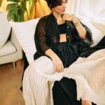 Neha Sharma Instagram - Another day, another slay… 👣🤍🖤 . . . Photography: @leroifoto Styling: @aeshah Shirt, trousers: @urvashikaur Top: @massimodutti Bracelets, rings: @myrhabyrhea Hair : @tejisinghofficial